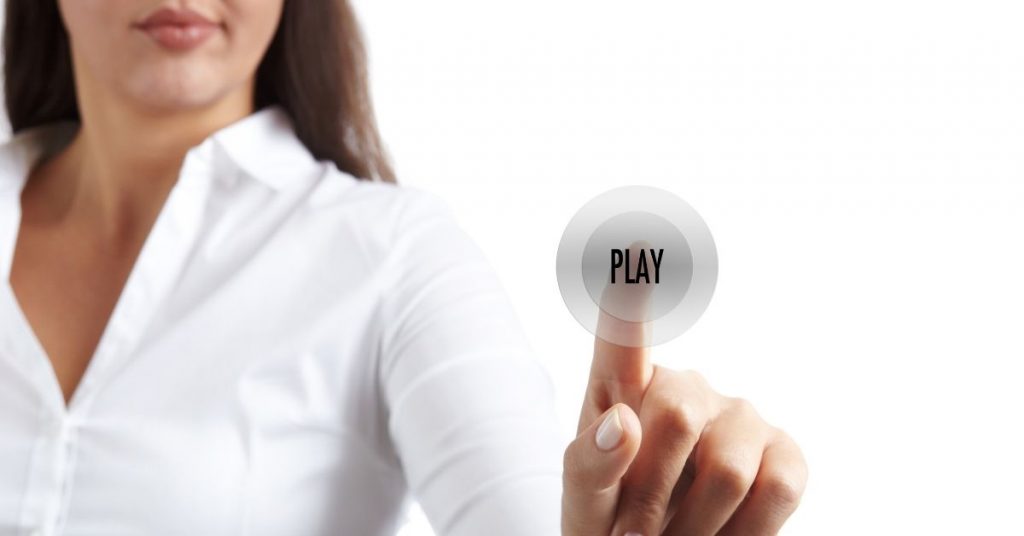 finger pushing "play" button
